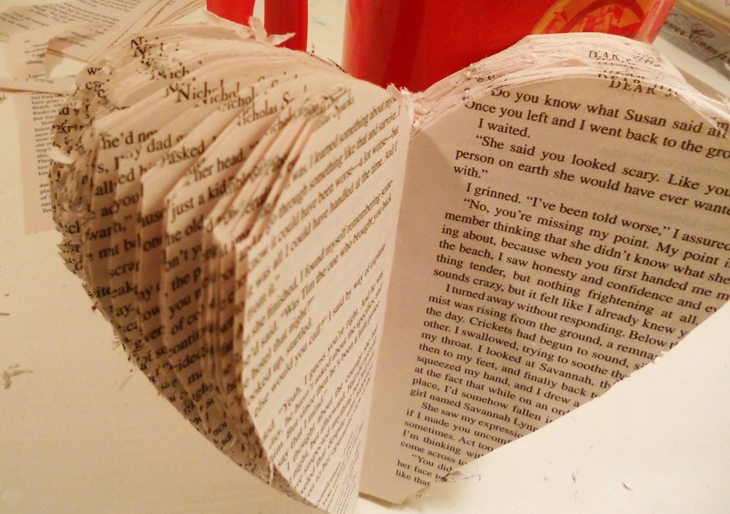 Paper book heart project for Valentine's Day on orsoshesays.com #paperbookheart #paperheart #bookheart #craft #DIY #valentinesday #osss