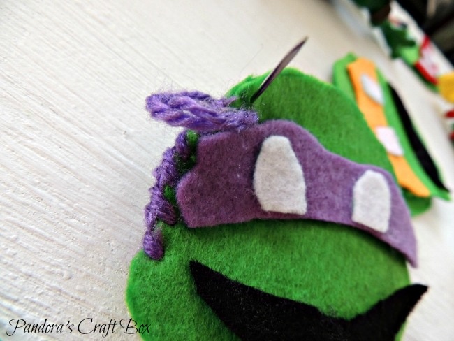 Felt Ornaments - Craft Your Kids' Favorite Characters this Christmas www.orsoshesays.com #christmas #DIY #feltornaments #ninjaturtles #hellokitty #characterornaments