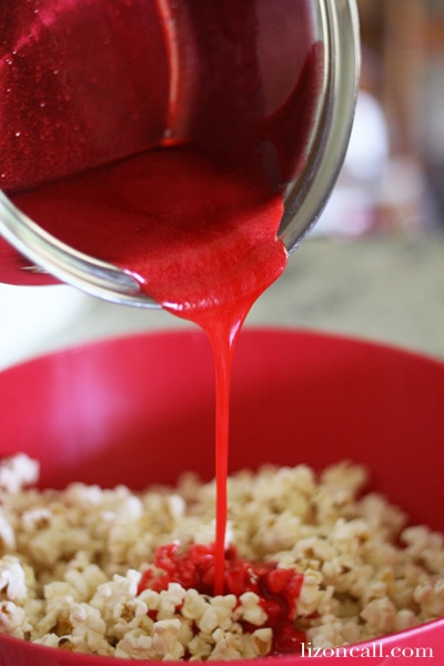 these jello popcorn balls are super fun to make with the kids and they taste yummy too! Great summer activity.