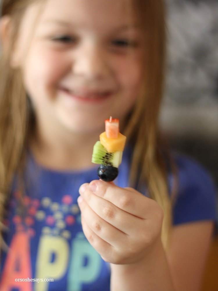 Summer fruit is in season and it is the perfect snack for kids. Get them excited about eating healthy and make some mini fruit kabobs together. www.orsoshesays.com #recipes #summer #healthy #fruitkabobs