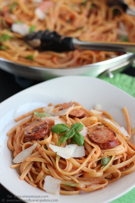 Roasted red pepper and sausage alfredo is a crowd-pleaser! Check out the recipe today on www.orsoshesays.com.