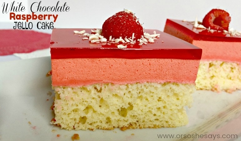 Don't let this white chocolate raspberry jello cake fool you! It's a dressed up box cake mix with everyone's favorite jiggly indulgence on top. Get the recipe on the blog: www.orsoshesays.com