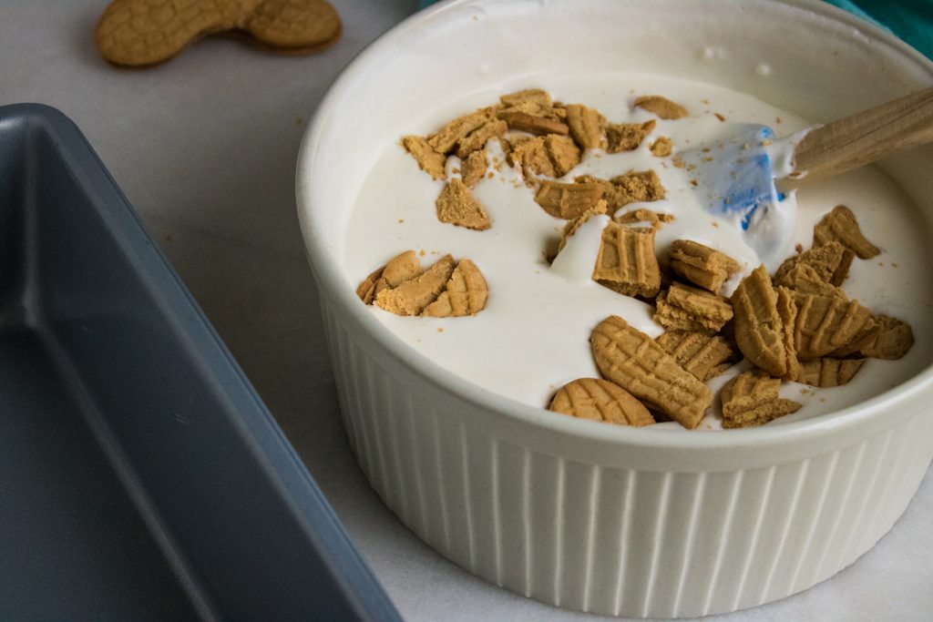 Nutter Butters add a great flavor to this no-churn ice cream. Enjoy one last summer hurrah with crumbled cookies layered between sheets of ice cream. #icecream #dessert #nutterbutters #cookies #summer #recipe #osss #orsoshesays #mormonblogger #mormon #ldsblogger #lds