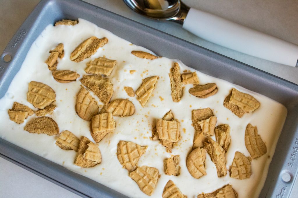 Nutter Butters add a great flavor to this no-churn ice cream. Enjoy one last summer hurrah with crumbled cookies layered between sheets of ice cream. #icecream #dessert #nutterbutters #cookies #summer #recipe #osss #orsoshesays #mormonblogger #mormon #ldsblogger #lds